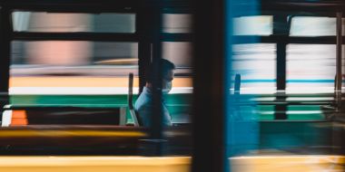 Man on bus with face mask